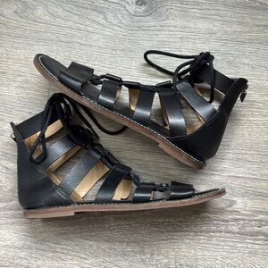MICHAEL KORS Black Leather Gladiator Sandals with Lace-Up Design